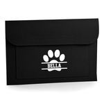 Load image into Gallery viewer, A black felt pouch or sleeve with a white paw print graphic and the name 'BELLA' printed in the centre, shown on a clean white background.