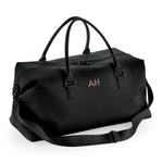 Load image into Gallery viewer, A black duffel bag with a personalized monogrammed logo on the front.