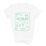 Load image into Gallery viewer, A white short-sleeve crewneck t-shirt with a mint green graphic print on the front. The graphic features the text 'KISS THIS MISS goodbye' and 'REBECCA'S HEN LEEDO 2027' along with various cocktail and party-themed doodles.