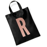 Load image into Gallery viewer, Black initial mini tote bag with a rose gold letter R