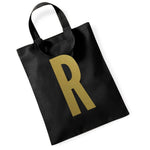 Load image into Gallery viewer, Black initial mini tote bag with a gold letter R