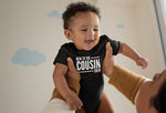 Load image into Gallery viewer, Baby wearing a black New To The Cousin Crew bodysuit with white print