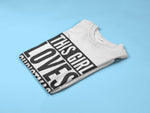 Load image into Gallery viewer, Folded white This Girl Loves Christmas T-shirt with black print