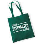 Load image into Gallery viewer, a green bag that says easily distracted by dogs