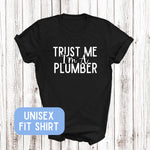 Load image into Gallery viewer, a black shirt that says trust me i'm a plumber