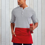Load image into Gallery viewer, Man wearing a red waist apron