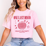 Load image into Gallery viewer, Woman wearing a light pink One Last Disco hen party T-shirt with red disco ball print