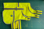 Load image into Gallery viewer, Hi vis dog vest flatlay showing small, medium and large sizes with ruler