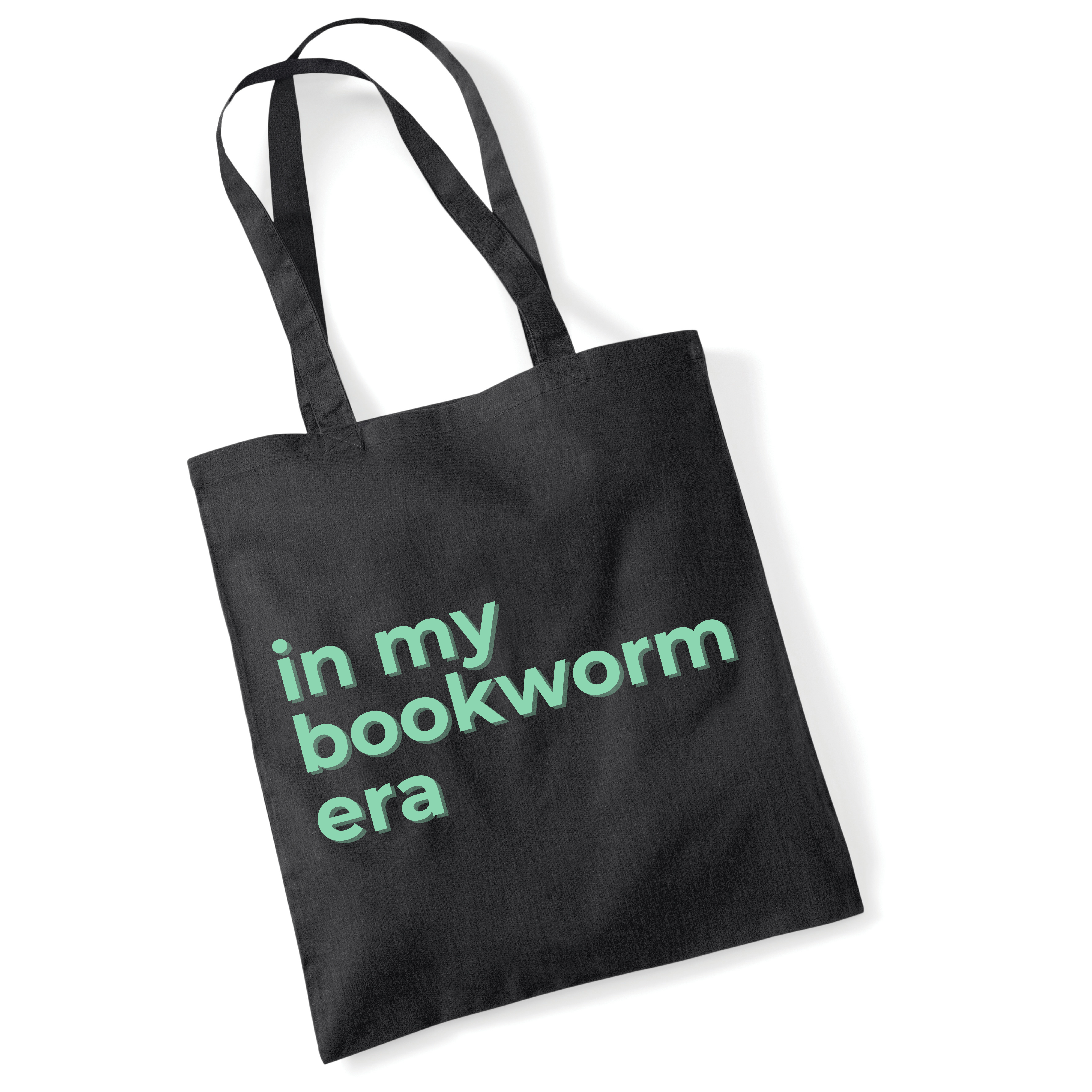 Black tote bag with 'in my bookworm era' text in green on a white background