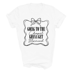 Load image into Gallery viewer, A white short-sleeve crewneck t-shirt with a black graphic print on the front. The graphic features a decorative wavy frame with a bow at the top and the text 'GOING TO THE Chapel GONNA GET Married' in mixed script and serif fonts.
