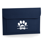 Load image into Gallery viewer, A navy blue felt envelope-style pouch or sleeve with a white paw print graphic and the name 'BELLA' printed in the centre, shown on a clean white background.
