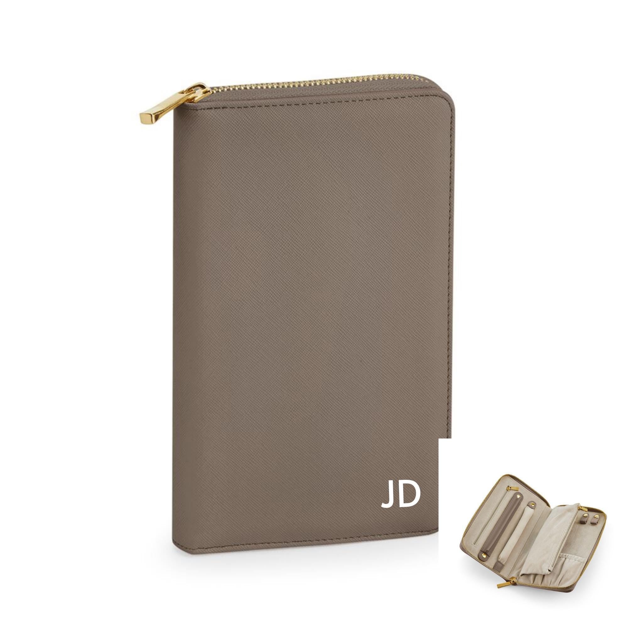 A tan leather wallet with a zipper closure and a personalized initials &quot;JD&quot; printed on it.