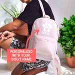 Load image into Gallery viewer, a person with a pink backpack with a dog&#39;s name on it
