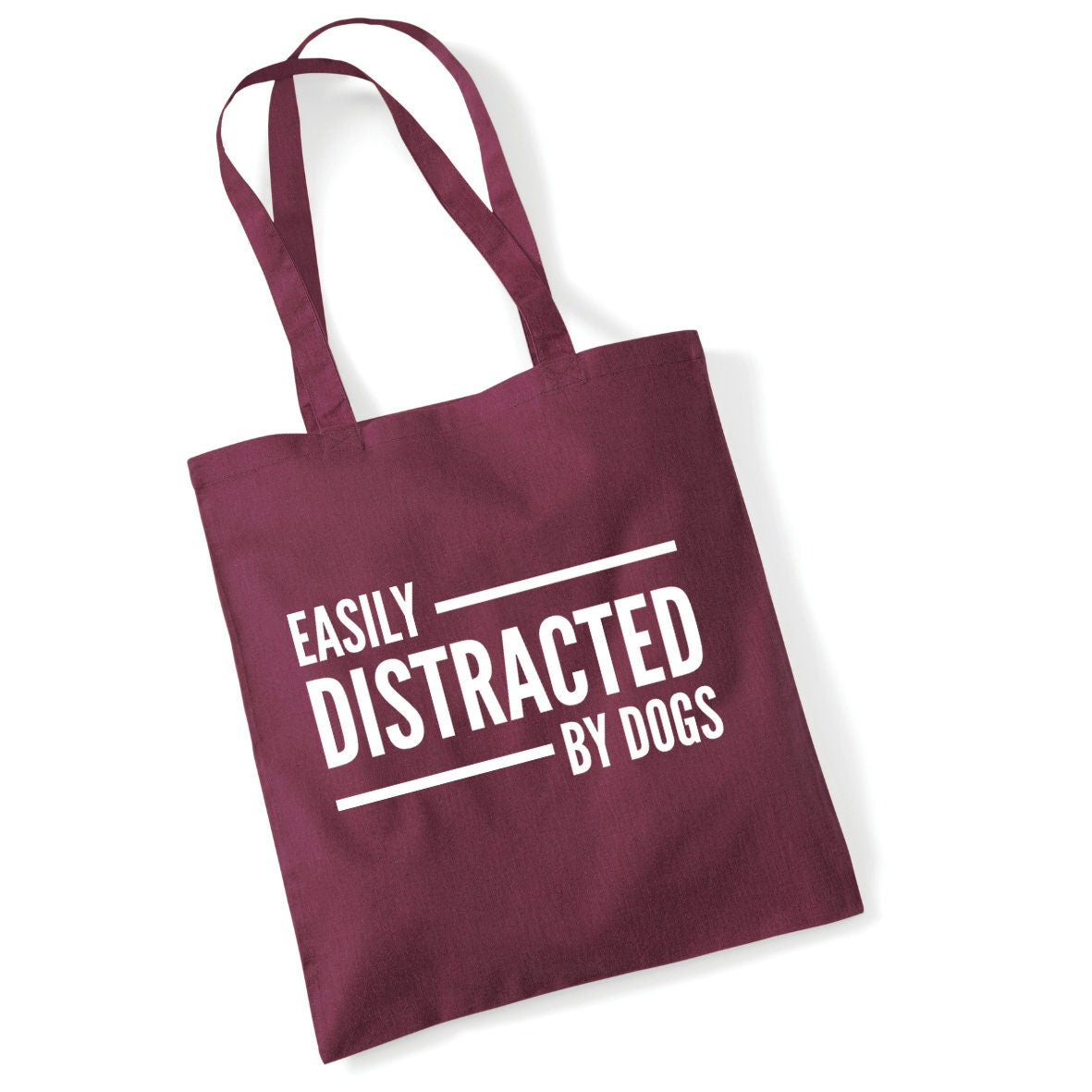 a red bag that says easily distracted by dogs