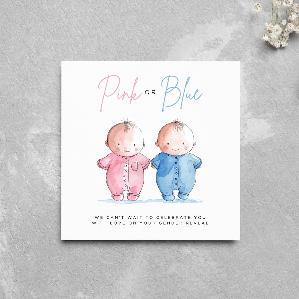a card with two babies in pink and blue