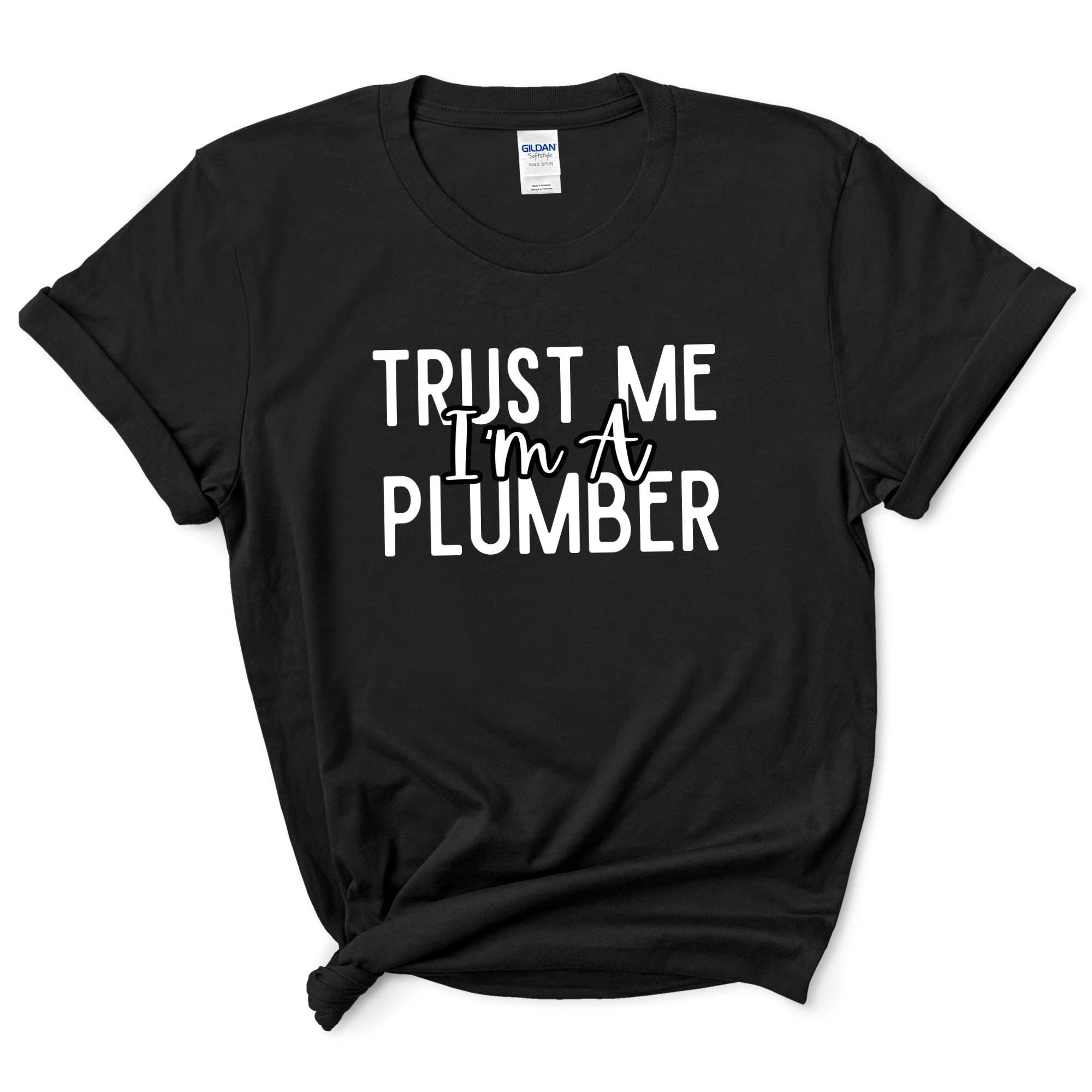 a black shirt that says trust me i'm a plumber