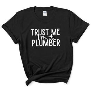 a black shirt that says trust me i'm a plumber