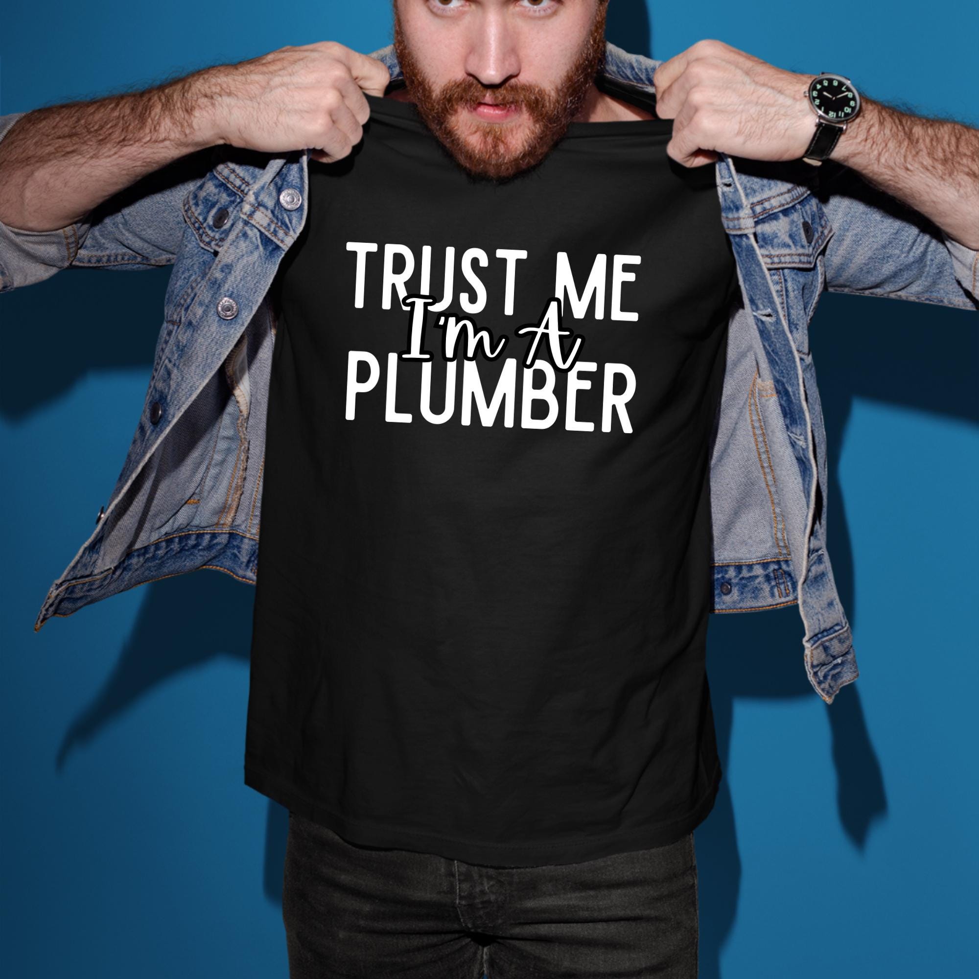 a man holding up a t - shirt that says trust me i'm a