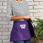 Load image into Gallery viewer, Purple waist apron showing the print position above the centre pocket

