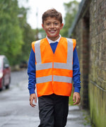 Load image into Gallery viewer, Boy wearing an orange kids hi vis vest
