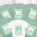 Load image into Gallery viewer, Green t-shirts with 'Bride's Last Rodeo' and 'Jess's Hen Party' text on a wooden surface.
